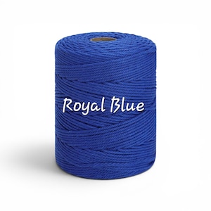 May include: A cylindrical spool of royal blue macrame cord featuring a twisted rope texture. The text Royal Blue is printed in white across the center of the spool, which is wound tightly with a consistent, vibrant blue fiber throughout the entire piece.