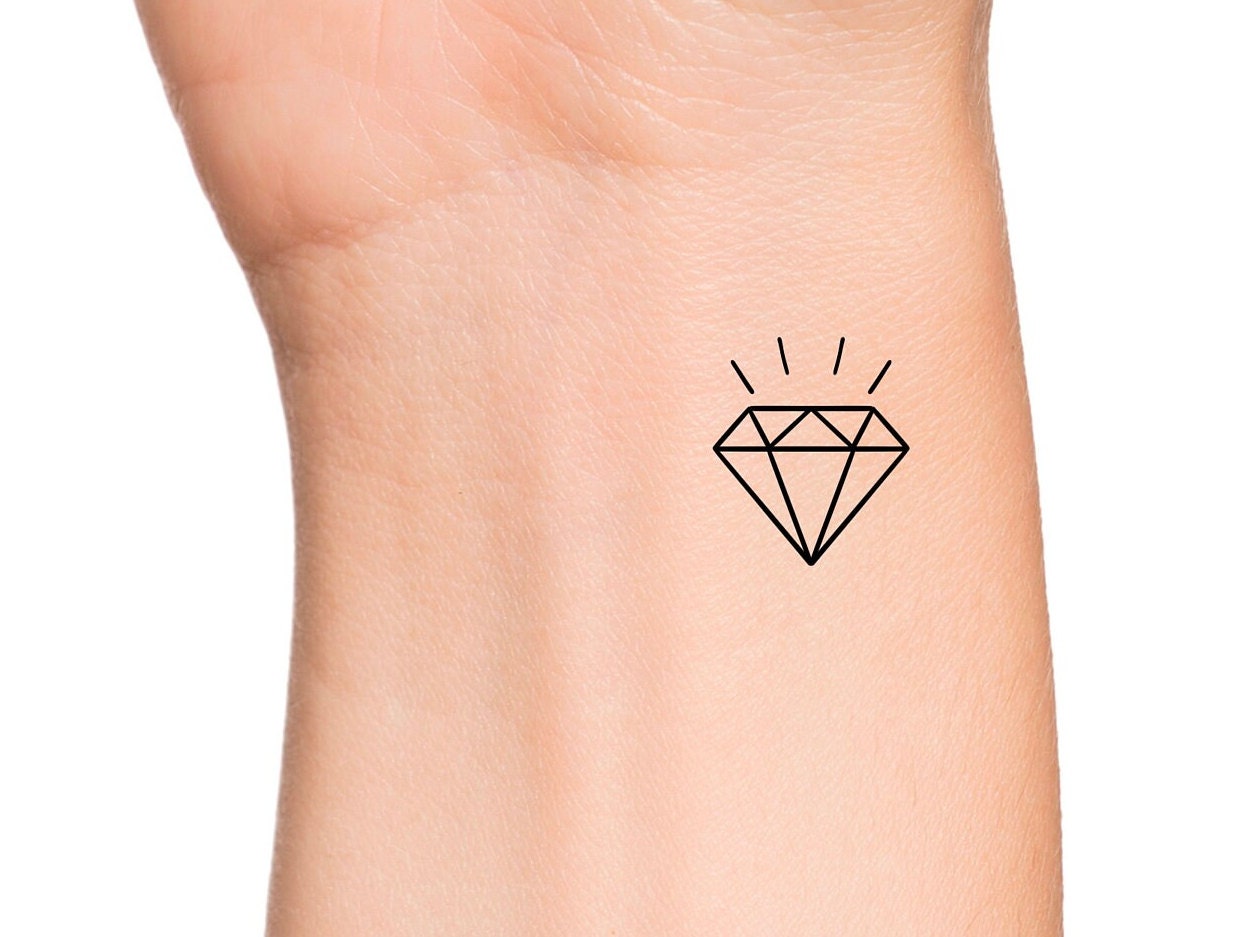 Diamond on Ring Finger Tattoo Idea