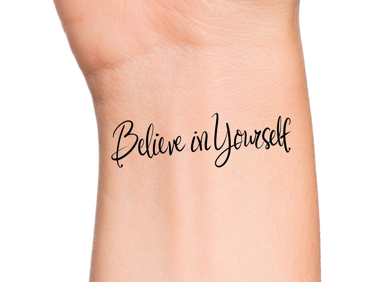 Tattoo that says believe in yourself located on the