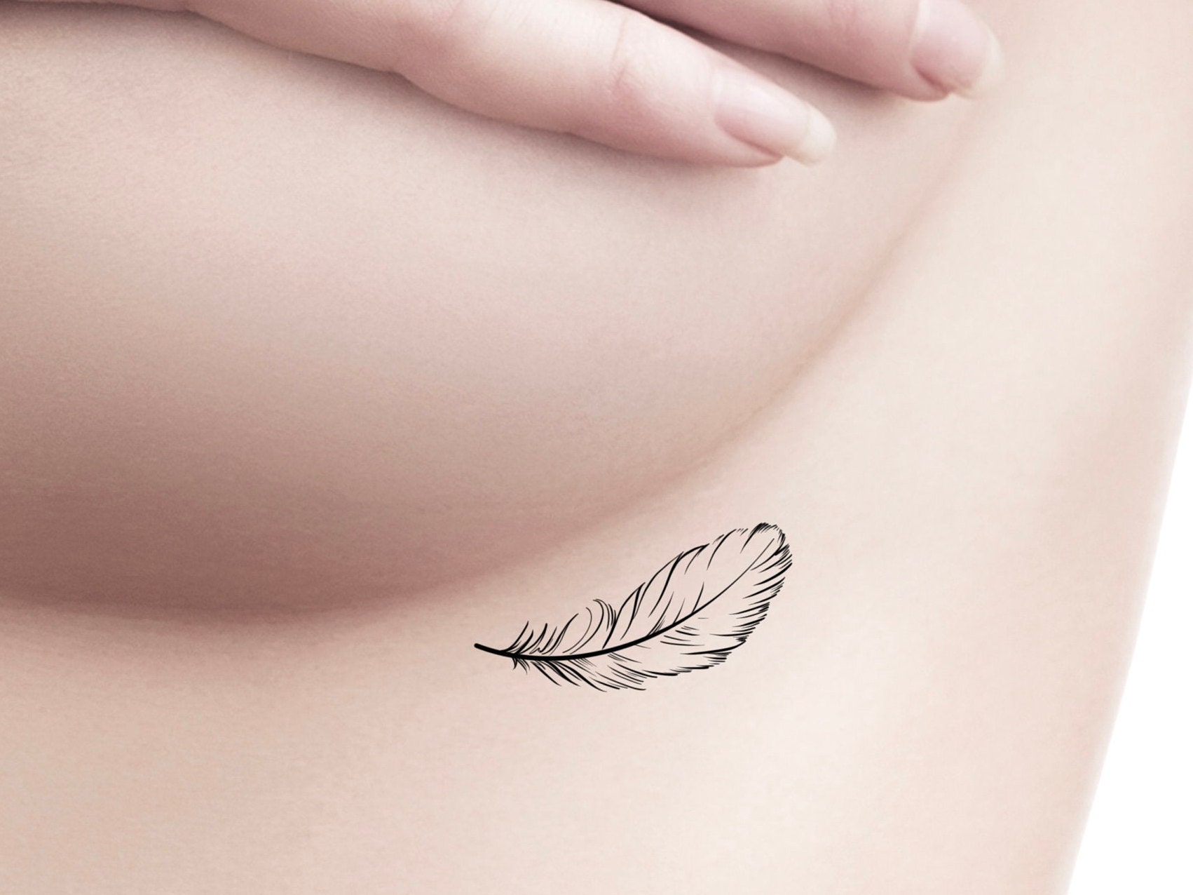 25 Feather Tattoo Designs  Meaning 2023  The Trend Spotter