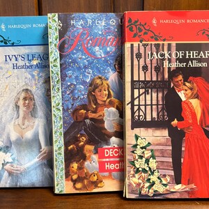 May include: Three Harlequin Romance paperback books with a winter theme. The covers feature a bride in a white dress, a woman in a red dress, and a woman in a blue dress. The titles are "Ivy's League", "Deck the Halls", and "Jack of Hearts".
