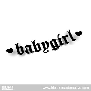 May include: A black "babygirl" decal in a gothic font, with a heart on each side. The decal is on a white background. The bottom of the image has the text "BLOSSOM AUTOMOTIVE" and "www.blossomautomotive.com".