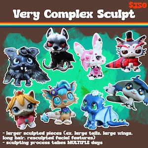 May include: A collection of seven stylized animal figurines featuring diverse designs, including a black bat, a wolf, a pink and white creature, a cat in a top hat, a blonde-haired figure, a blue-haired creature, and a blue dragon with wings.