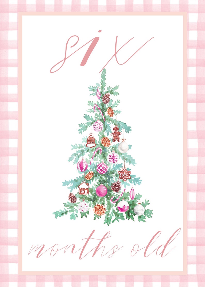 May include: A pink and white gingham background with a white card in the center. The card has the text "six months old" written in pink cursive. A watercolor illustration of a Christmas tree with pink and white ornaments is in the center of the card.