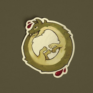 May include: A sticker depicting an ouroboros, a serpent consuming its tail, in green and tan hues. The serpent has visible teeth and a white border. Red droplets, resembling blood, are positioned near the serpent.