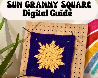 May include: A close-up of a crochet granny square with a yellow sun design in the center. The square is pinned to a wooden board with metal pins. The text "SUN GRANNY SQUARE Digital Guide" is at the top of the image.