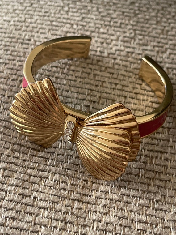 Buy the Designer Kate Spade Gold-Tone Blue Enamel Take A Bow Bangle Bracelet  | GoodwillFinds