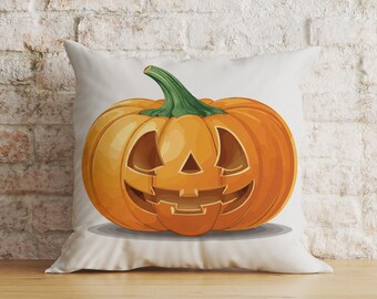 May include: A white pillow with a cartoon image of an orange pumpkin with a carved jack-o'-lantern face.