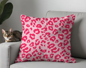 Funda de almohada con estampado de leopardo rosa, decoración moderna y glamurosa.