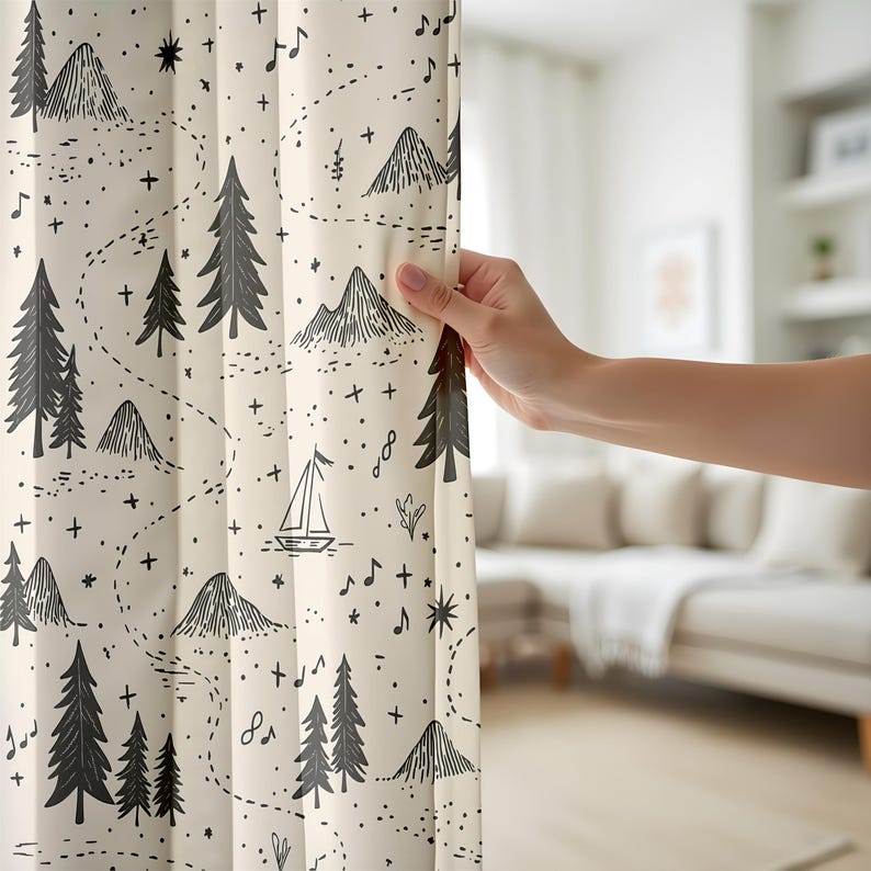 May include: A cream-colored curtain featuring a repeating black line-art pattern of pine trees, mountain peaks, a small sailboat, musical notes, and stars connected by dotted paths. The fabric has a smooth texture and vertical folds.