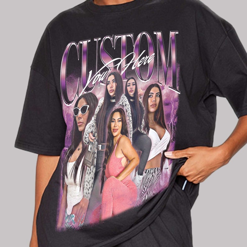 May include: Black oversized t-shirt with a graphic print of four women. The print features a purple and white lightning bolt design and the text "CUSTOM You Here".