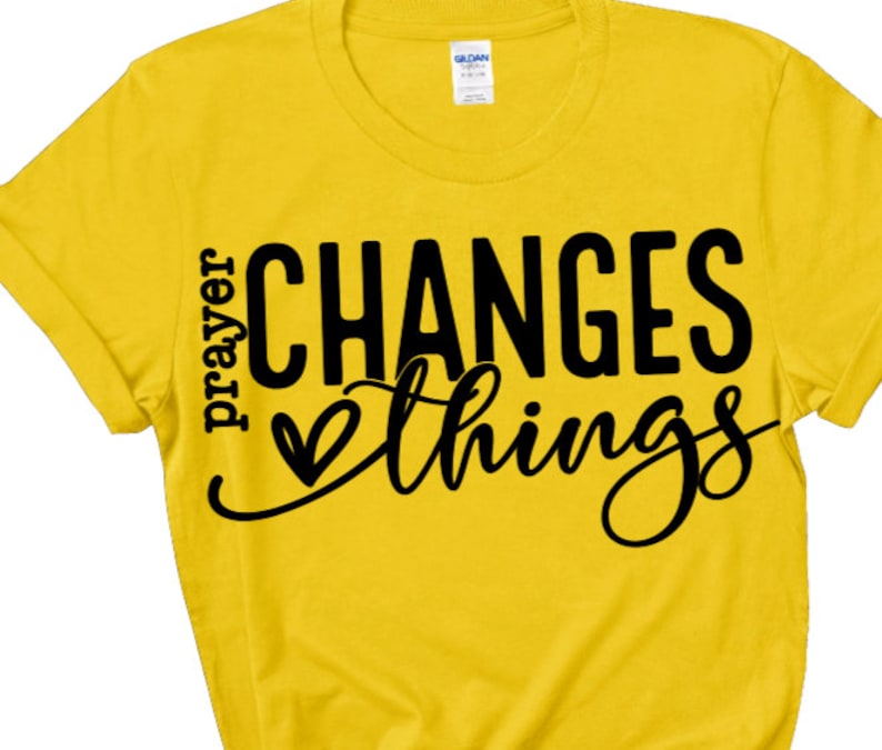 May include: Yellow t-shirt with black text that reads "prayer changes things" with a heart symbol.