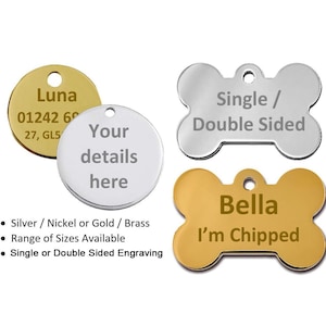 May include: Pet ID tags in gold and silver. One circular tag has "Luna" and contact details, another says "Your details here". Bone-shaped tags include "Bella, I'm Chipped" and a silver tag with "Single / Double Sided".