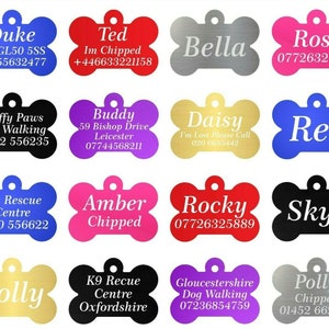 May include: A collection of 12 colourful bone-shaped dog tags with engraved text. The tags feature various names, phone numbers, and messages, such as "Duke", "Ted", "Bella", "Rose", "Fluffy Paws Dog Walking", "Buddy", "Daisy", "Rex", "Pet Rescue Centre", "Amber", "Rocky", "Skye", "Polly", "K9 Recue Centre", "Gloucestershire Dog Walking", and "Polly".