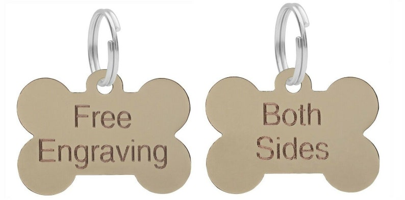 May include: Two gold bone-shaped dog tags with silver rings. The tag on the left says "Free Engraving". The tag on the right says "Both Sides".