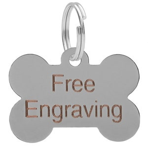 May include: Silver bone-shaped dog tag with a silver ring and the words "Free Engraving" in copper.