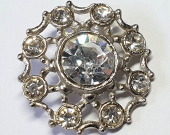 White paste button. White paste border and large central paste in white metal fretwork. Circa 1950s.  13/16 inch  or 21 mm. MB086