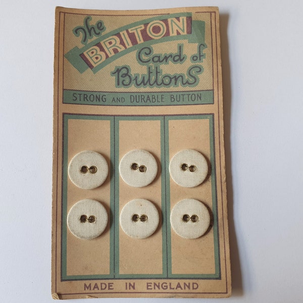 1 pack of 6 linen buttons on original card titled The Briton Card of Buttons.  Circa 1900s.  5/8 " or  17 mm.  NM186