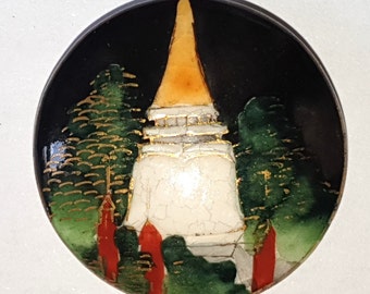 1 Japanese Satsuma ceramic button featuring a temple and trees. Tunnel shank. 20th Century. 1 1/16" or 27mm. Sat 7041