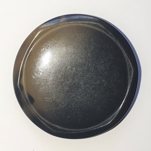 Tight top celluloid coat button with faceted edges. Grey to black. Circa 1900s. Metal loop back.  1 15/16 &quot; or 49 mm. CB356