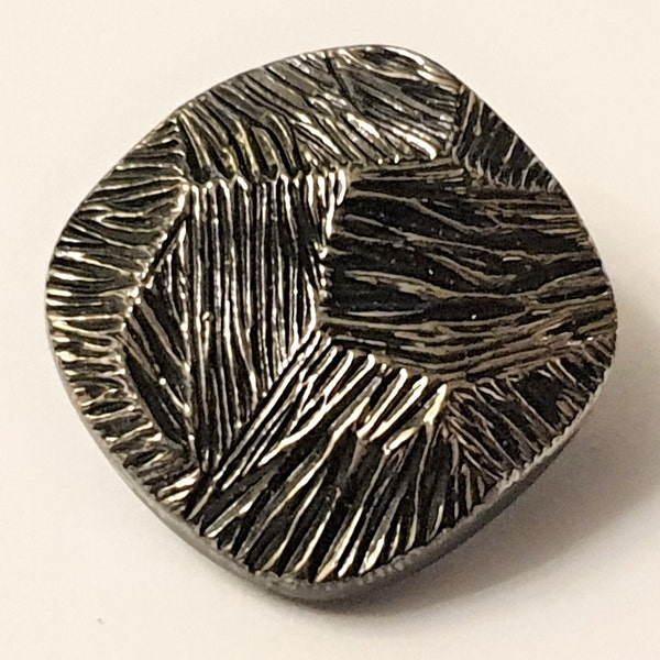 1 square black glass button with silver lustre. Bark like appearance. Circa 1950s.  Self loop shank.  13/16 " or 20 mm.  GB244