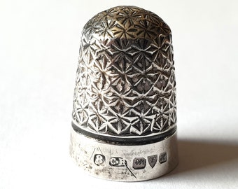 1 Charles Horner Sterling Silver thimble. Marked Chester 1908.  5/8" wide by  15/16 " high. Thimble 1