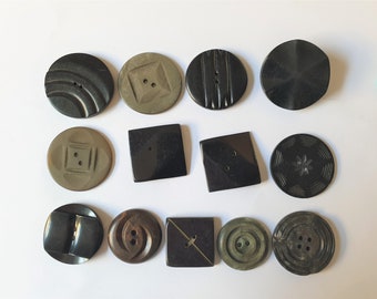 13 Art Deco buttons. Different colours. Sizes from 1 1/16" to 1 7/16". 1 loop shank, 1 2-sewing holes, 1 4-sewing holes. 1920s. CB361