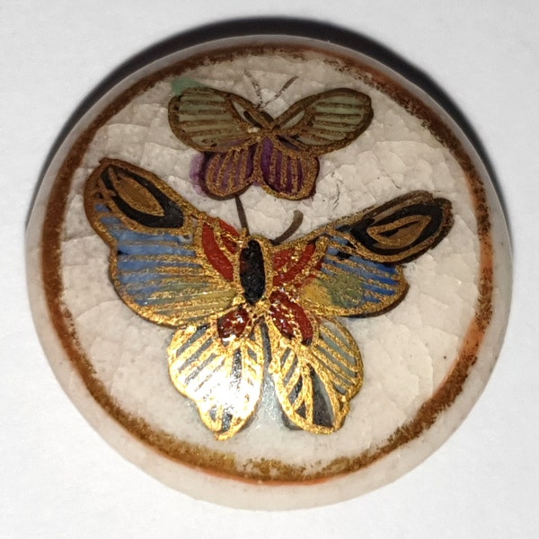 1 small 1880s Japanese Satsuma ceramic button picturing two butterfly's. 22 carat gold decoration. Self shank. 9/16" or 14mm. Sat 7027