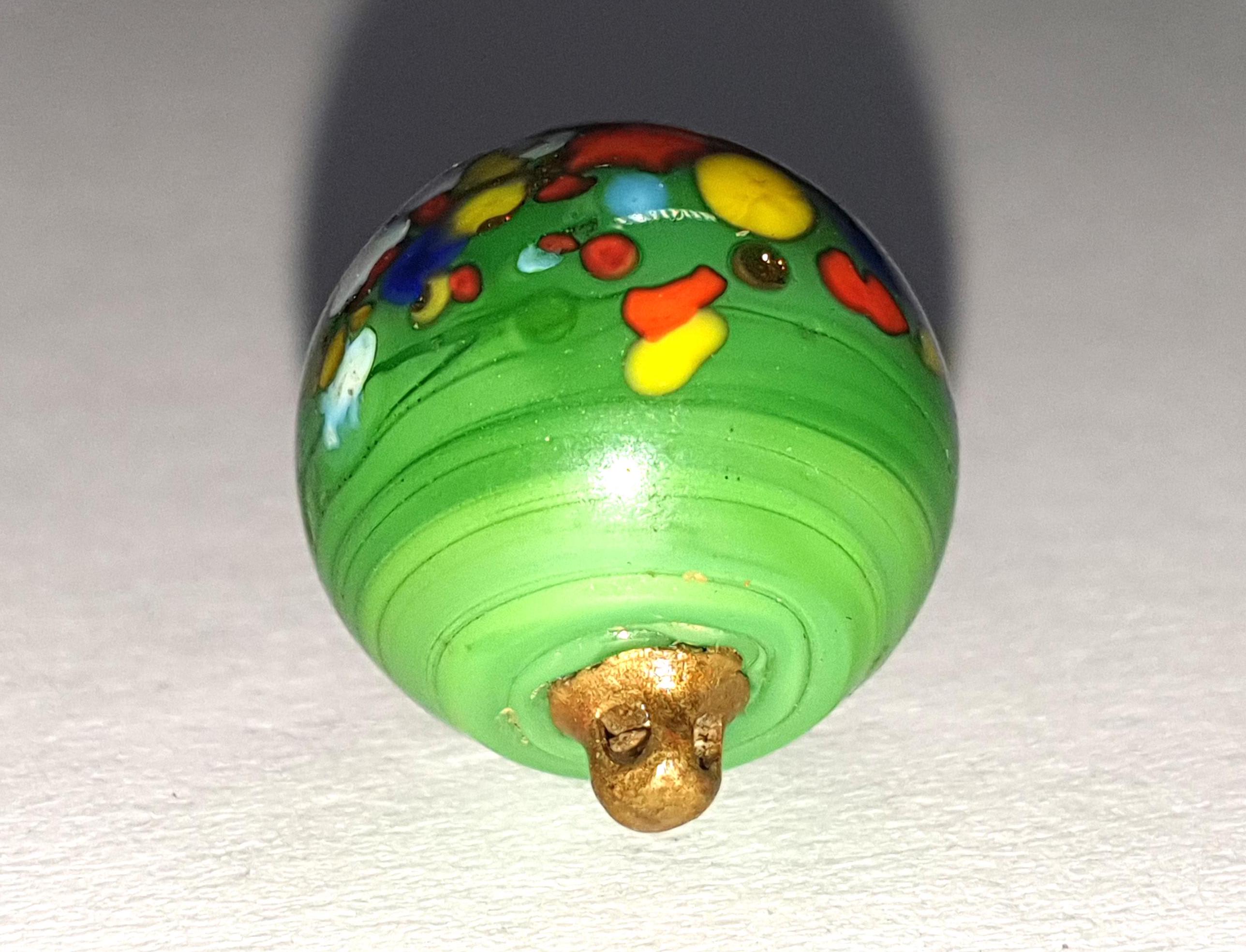 Italian Murano green glass paperweight button with multicoloured speckled spots. 1920s. Brass loop shank. 1/2 inch wide or 13mm. PW785