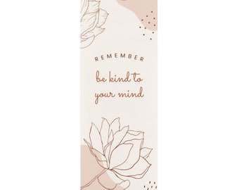 May include: A beige and brown yoga mat with a floral design and the text "REMEMBER be kind to your mind".