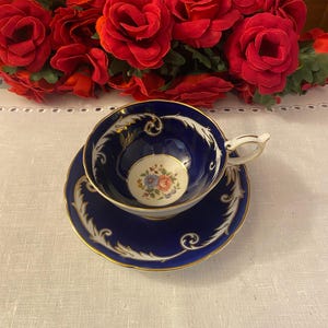 Aynsley Teacup and Saucer Cobalt Blue and Gold with Floral center
