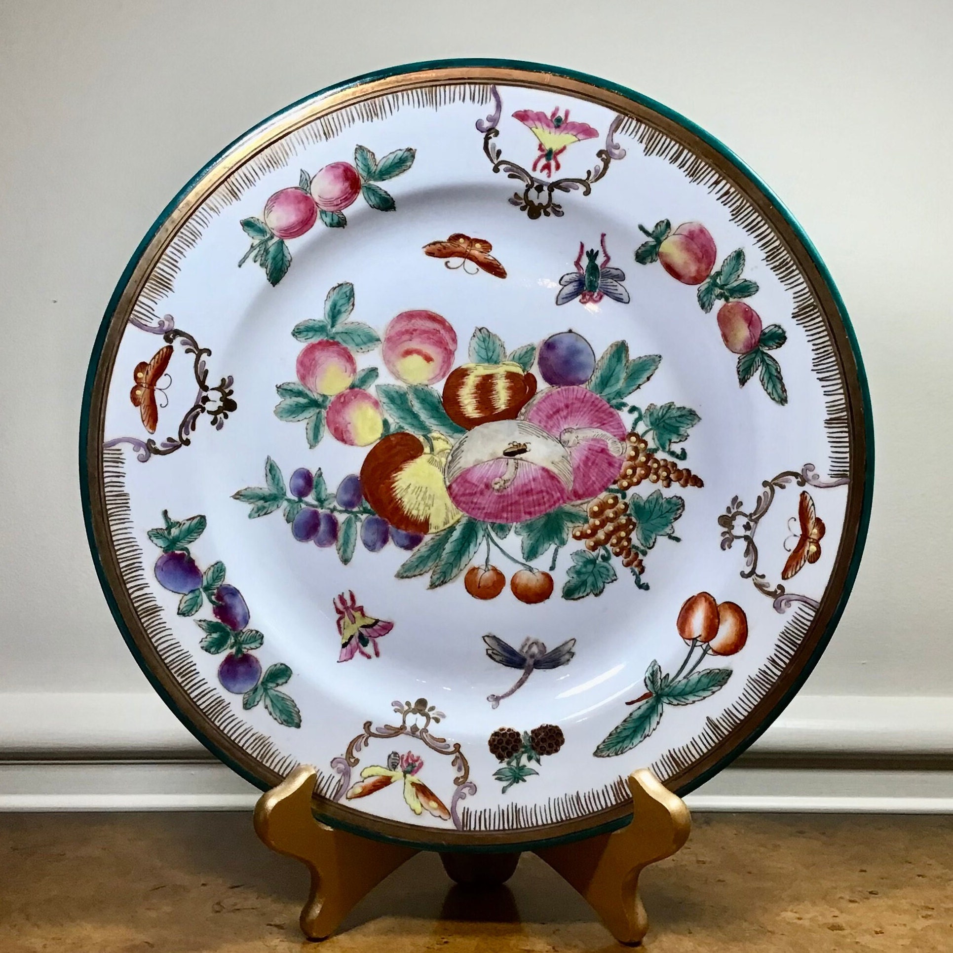 Vintage Chinese Export Decorative Plate. Adorned  with Butterflies, Insects, Fruit and Mushrooms in multiple colors. 10.5" across.