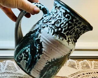 Vintage Edna Arnow, Chicago Studio Pottery Pitcher, Fat Lava Glazed in White and Blue over Charcoal Black. Signed by the artist.