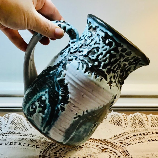 Vintage Edna Arnow, Chicago Studio Pottery Pitcher, Fat Lava Glazed in White and Blue over Charcoal Black. Signed by the artist.