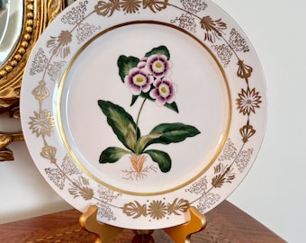 Botanisch bord Chelsea House Primrose met goudverguld ontwerp op de rand. 10,5 inch breed. Vintage.