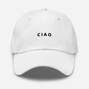 May include: A white baseball cap with the word "CIAO" in black lettering on the front.