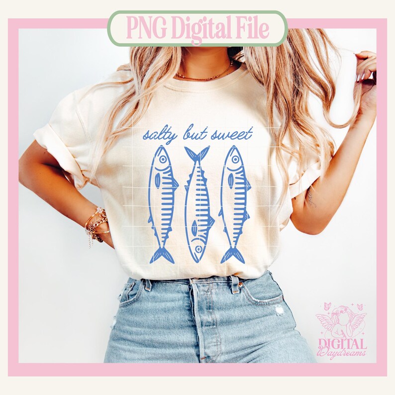 May include: Cream-colored t-shirt with the text "salty but sweet" above three blue fish illustrations. The shirt is paired with denim shorts. The image has a PNG Digital File label.