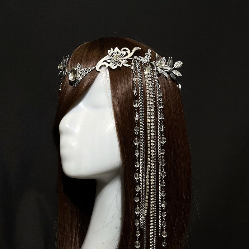 a jeweled headpiece similar to a crown is