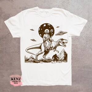 Jesus Riding Dinosaur T Shirt UFO T Shirt Funny T Shirts Offensive T Shirt Cool Graphic T Shirts Crazy Shirts For Men Women Guys Novelty Tee