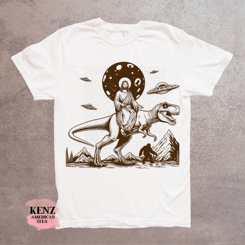 Jesus Riding Dinosaur T Shirt UFO T Shirt Funny T Shirts Offensive T Shirt Cool Graphic T Shirts Crazy Shirts For Men Women Guys Novelty Tee