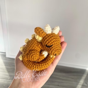 May include: A set of three ceramic mugs with a speckled, matte finish. The mugs are in shades of cream, light gray, and dark gray. Each mug has a simple, minimalist design, perfect for coffee or tea.