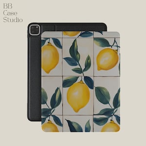 May include: A black leather iPad case with a white and yellow lemon print. The case features a repeating pattern of lemons and green leaves on a white background.