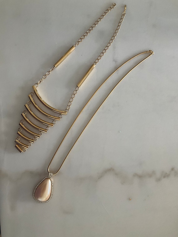 Two brass/gold costume necklaces