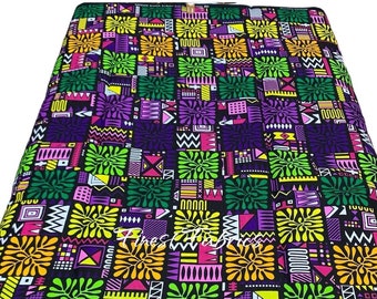 May include: A colorful fabric with a geometric pattern in shades of green, purple, yellow, pink, and white on a black background.