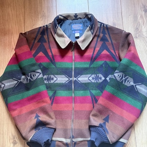 May include: A set of three ceramic mugs with a speckled, matte finish in cream, light grey, and dark grey. Each mug has a simple, modern design and a rounded handle.