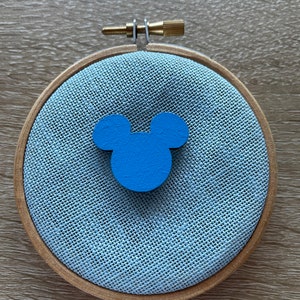 Blue wooden mouse shaped needle minder