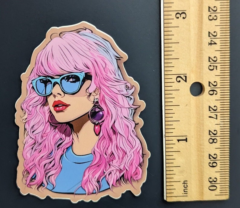 May include: A sticker featuring a woman with pink and purple hair, wearing blue sunglasses and a blue shirt. She has a purple and pink earring.