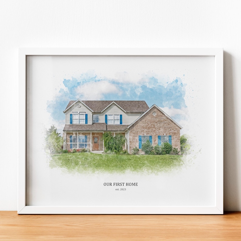 May include: A watercolor illustration of a two-story house with a brick facade and blue shutters. The house is surrounded by green grass and trees. The text "OUR FIRST HOME est. 2023" is printed below the house.