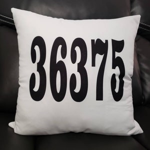 May include: White pillow with black text that reads "36375".