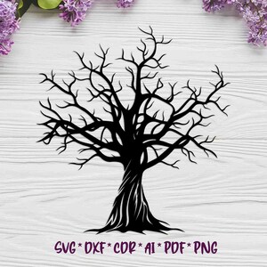May include: Black silhouette of a bare tree with many branches. The tree is on a white wood background.